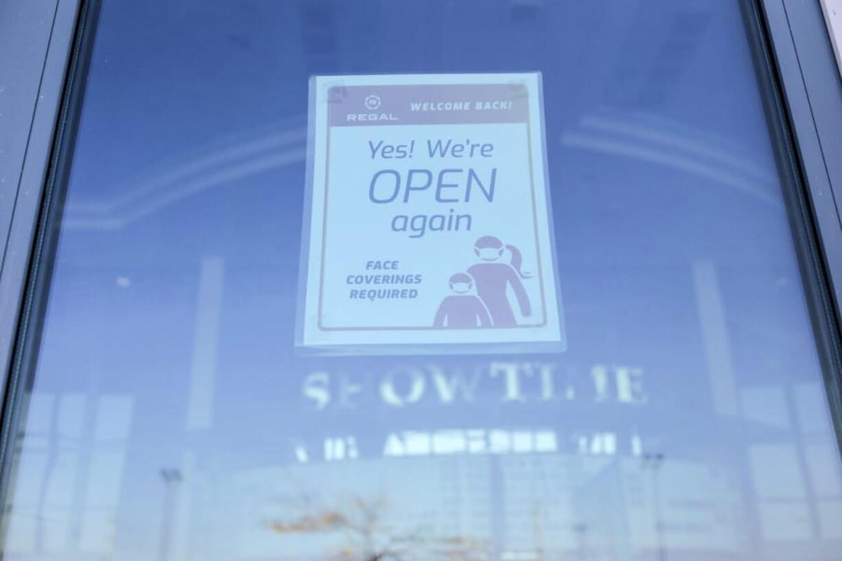 A sign is posted on a window of Regal Edwards Grand Teton theater in Idaho Falls, Idaho on Monday, Oct. 5, 2020.