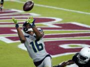 Seattle Seahawks wide receiver Tyler Lockett (16) pulls in a touchdown pass as Arizona Cardinals cornerback Dre Kirkpatrick (20) defends during the second half of an NFL football game, Sunday, Oct. 25, 2020, in Glendale, Ariz. (AP Photo/Ross D.