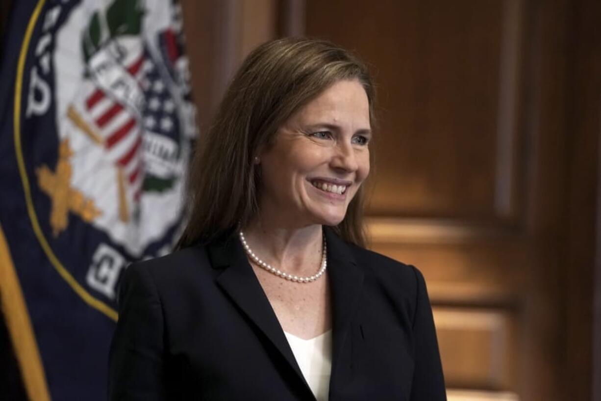 Supreme Court nominee Amy Coney Barrett, meets with Sen. Martha McSally, R-Ariz., Wednesday, Oct. 21, 2020, on Capitol Hill in Washington.