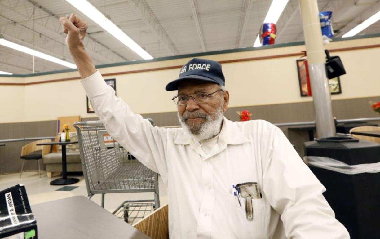 FILE - In this July 19, 2018, file photo, civil rights movement activist James Meredith, right, greets a friend with a black power salute as he takes a coffee break at a north Jackson, Miss., grocery store. &quot;Walk Against Fear: James Meredith,&quot; scheduled to air Thursday, Oct. 1, 2020, on the Smithsonian Channel, examines the life of a U.S. Air Force veteran-turn-human right agitator whose admission into the University of Mississippi forced President John F. Kennedy to send federal troops into the state to quell a white supremacy uprising. It was one of the most violent moments of the Civil Rights Movement and it forever changed life in the American Deep South. (AP Photo/Rogelio V.