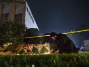 Rabbi Eli Wilansky lights a candle after a mass shooting at Tree of Life Synagogue in Pittsburgh&#039;s Squirrel Hill neighborhood on Oct. 27, 2018.