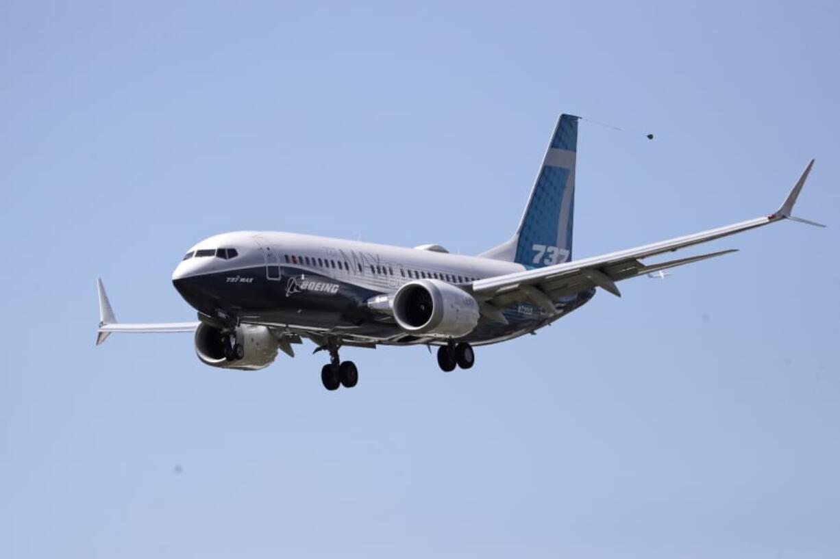 FILE - A Boeing 737 MAX jet heads to a landing at Boeing Field following a test flight in a Monday, June 29, 2020 file photo, in Seattle. Boeing is reporting more weak numbers for airplane orders and deliveries. The big aircraft maker said Tuesday, Aug. 11, 2020 it it sold no new airliners in July, and customers canceled orders for 43 of its 737 Max jet. That&#039;s the plane that has been grounded for more than a year after two crashes killed 346 people.