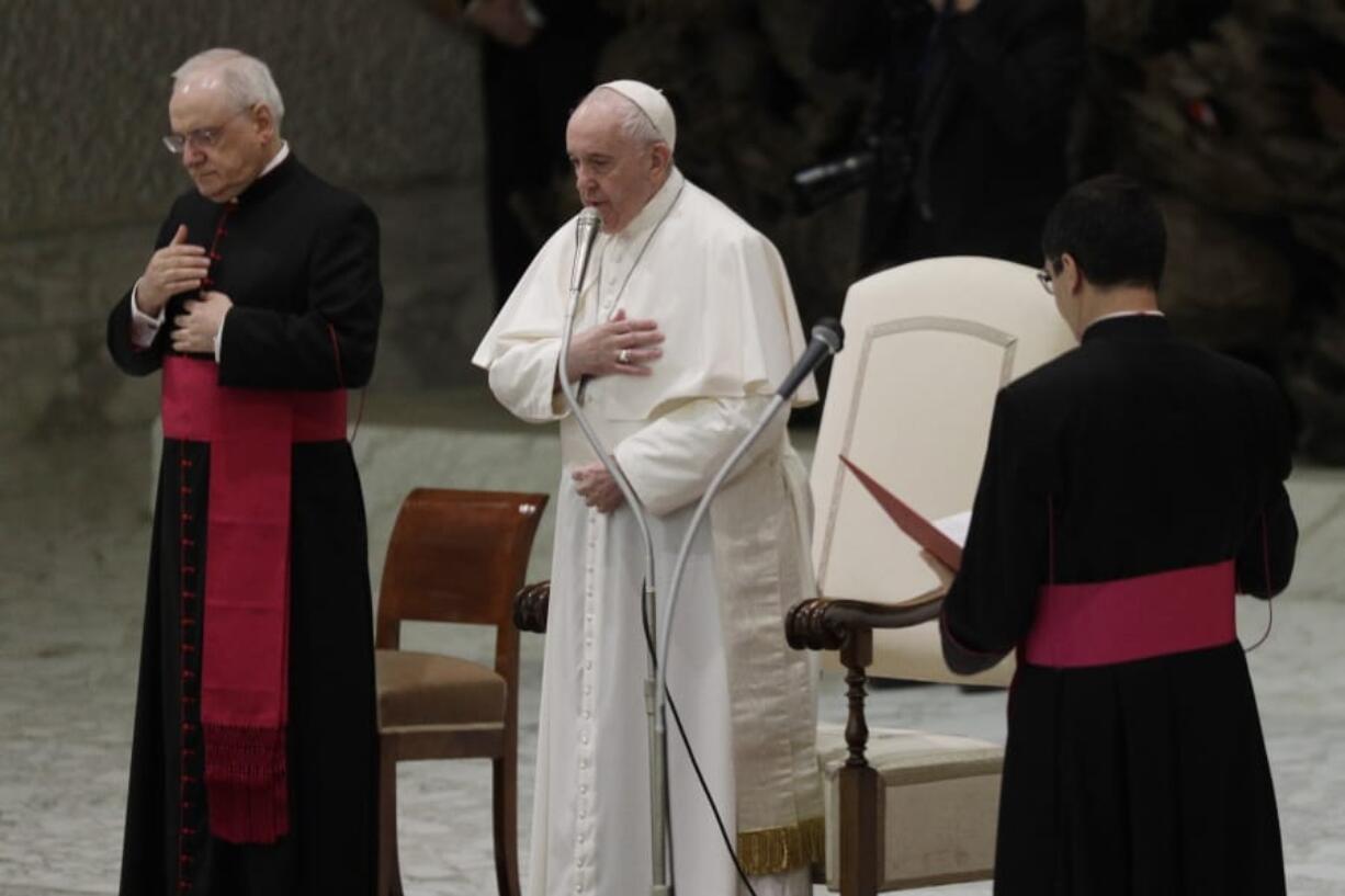 Pope Francis, center, makes the sign of the cross during his weekly general audience in the Paul VI hall at the Vatican, Wednesday, Oct. 21, 2020. Pope Francis endorsed same-sex civil unions for the first time as pope while being interviewed for the feature-length documentary &quot;Francesco,&quot; which premiered Wednesday at the Rome Film Festival.