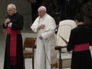 Pope Francis, center, makes the sign of the cross during his weekly general audience in the Paul VI hall at the Vatican, Wednesday, Oct. 21, 2020. Pope Francis endorsed same-sex civil unions for the first time as pope while being interviewed for the feature-length documentary &quot;Francesco,&quot; which premiered Wednesday at the Rome Film Festival.