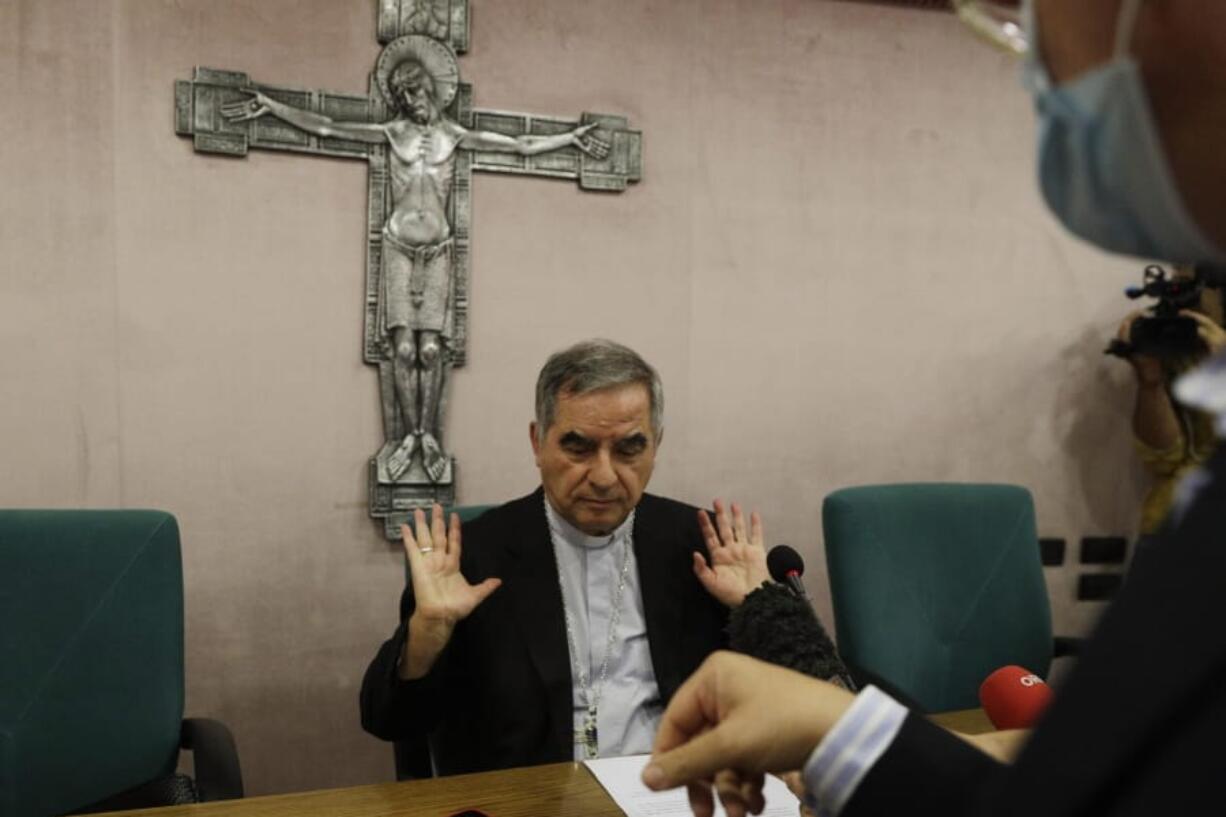 FILE - In this Sept. 25, 2020 Cardinal Angelo Becciu talks to journalists during a press conference in Rome. Italy&#039;s financial police said Wednesday, Oct. 14, 2020 that a Sardinian woman, Cecilia Marogna, said to be close to one of the Holy See&#039;s most powerful cardinals, Becciu, before his downfall, was arrested in Milan, northern Italy, late Tuesday on an international warrant issued by the Vatican City State.