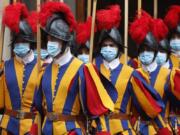 Vatican Swiss Guards, wearing masks to curb the spread of COVID-19, leave the St. Damaso courtyard after Spain&#039;s Prime Minister Pedro Sanchez meeting with Pope Francis, at the Vatican, Saturday, Oct. 24, 2020.