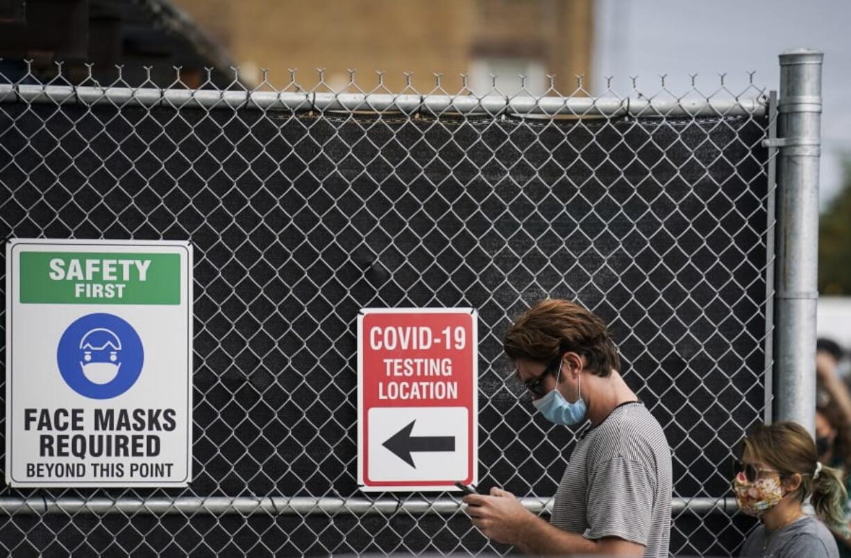 Patients wait on line outside a COVID-19 testing site that provides priority testing for NYC Department of Education staff through NYC Health + Hospitals on Ft. Hamilton Parkway, Wednesday, Oct. 7, 2020, in the Borough Park neighborhood of the Brooklyn borough of New York.