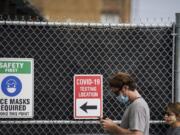 Patients wait on line outside a COVID-19 testing site that provides priority testing for NYC Department of Education staff through NYC Health + Hospitals on Ft. Hamilton Parkway, Wednesday, Oct. 7, 2020, in the Borough Park neighborhood of the Brooklyn borough of New York.