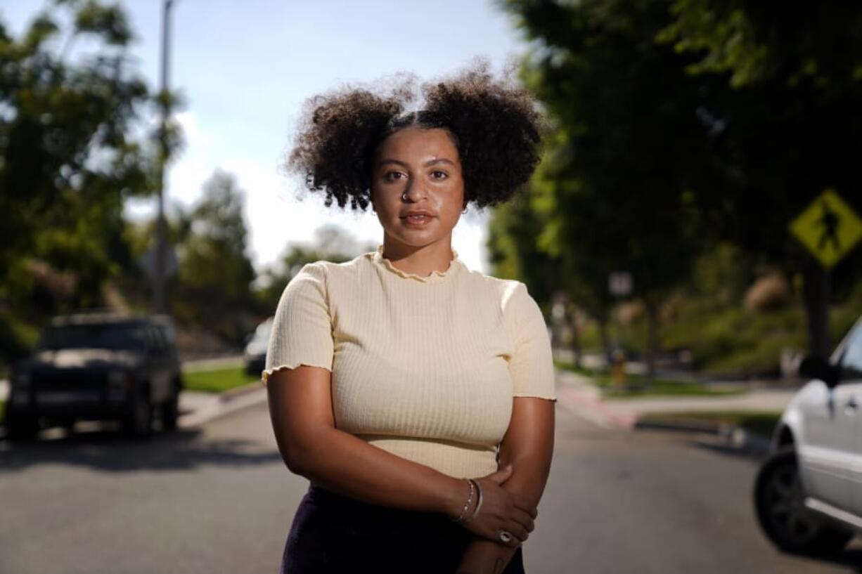 Amira Temple, a contact tracer for the COVID-19 virus, stands for a portrait Thursday, Oct. 22, 2020, in Chula Vista, Calif. Temple sees her job as an extension of her work as a civil rights activist in San Diego&#039;s Black and Hispanic communities. &quot;There&#039;s a gap within these communities of food, housing and security so COVID is kind of bringing these things to light,&quot; she said.