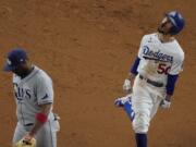 Los Angeles Dodgers&#039; Mookie Betts celebrates after a home run against the Tampa Bay Rays during the eighth inning in Game 6 of the baseball World Series Tuesday, Oct. 27, 2020, in Arlington, Texas.