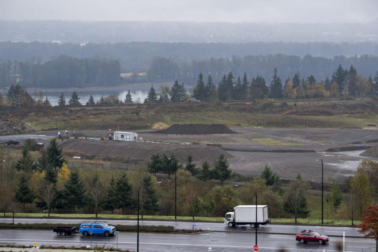 Motorists drive along Southeast 192nd Avenue through the old Fisher Quarry, where Hurley Development has plans to redevelop the west half. The east half is already under redevelopment.