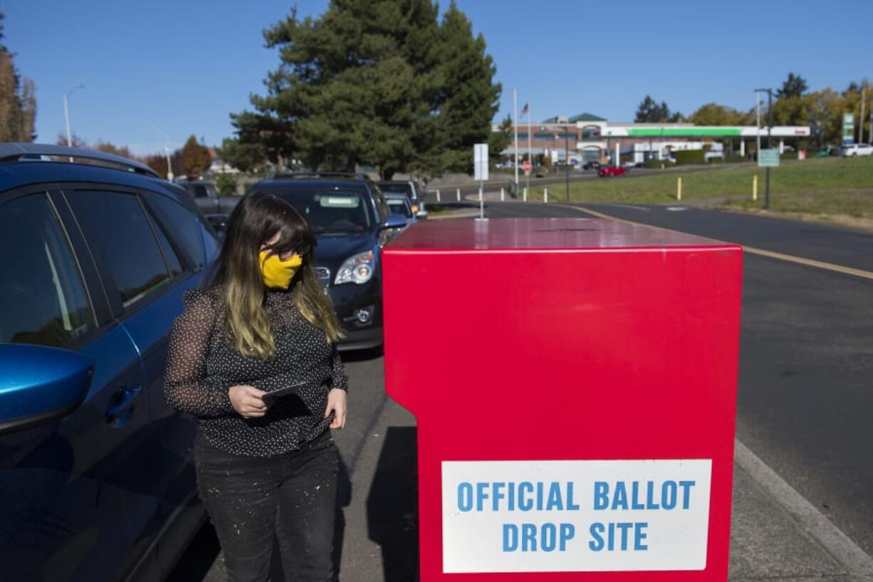 Voter Chelsea Unger joins a steady stream of local residents as they drop their ballots off in Fisher's Landing in time for this year's election.