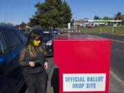 Voter Chelsea Unger joins a steady stream of local residents as they drop their ballots off in Fisher's Landing in time for this year's election.