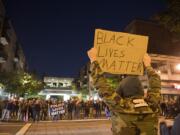 Black Lives Matter protesters face off against Blue Lives Matter and Patriot Prayer supporters in downtown Vancouver near Esther Short Park on Saturday night, Oct. 31, 2020.