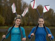 Rowers Kate Feustel, left, and Lauren Coop pause for a portrait at Vancouver Lake on Tuesday morning, Nov. 10, 2020.