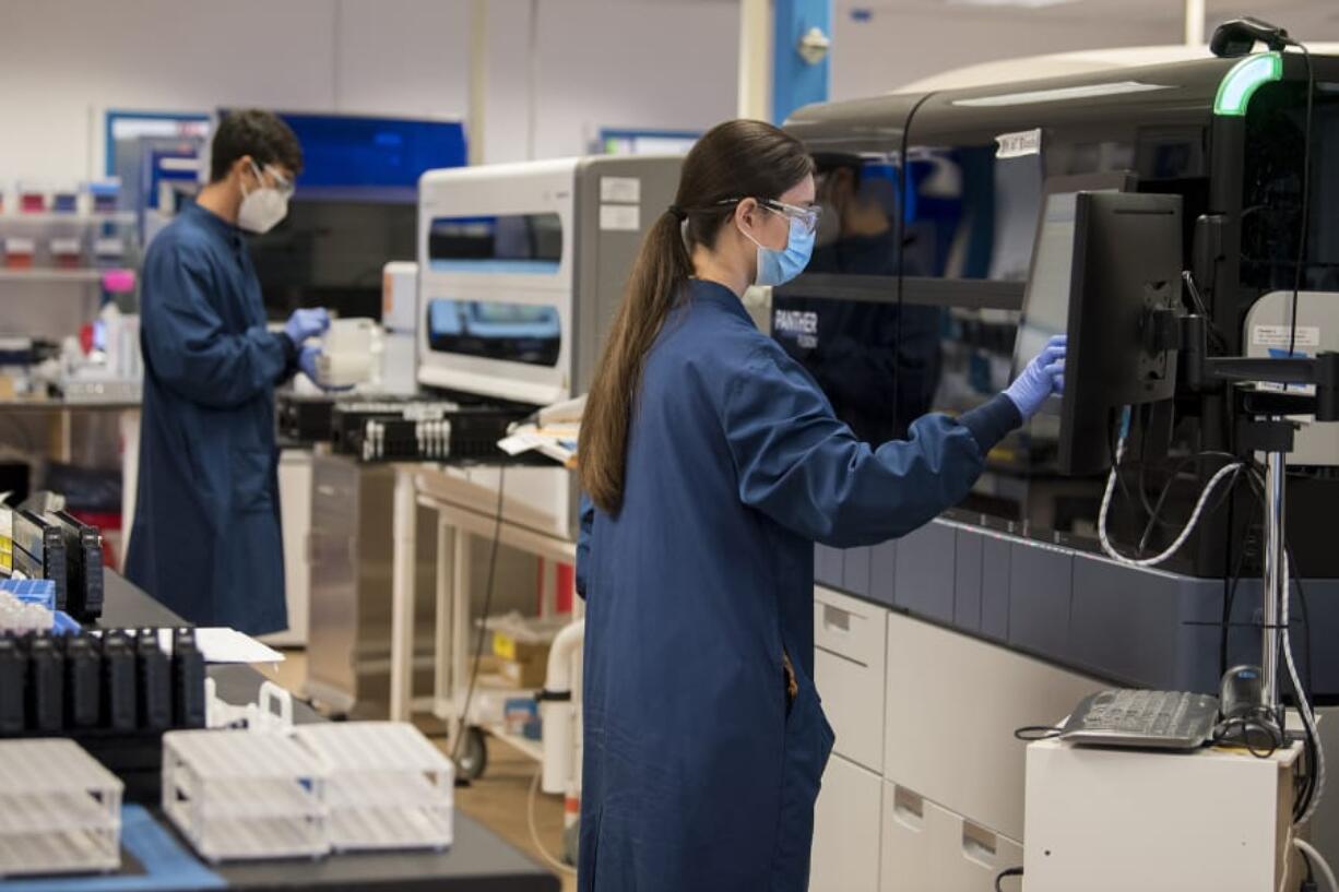 General lab technologists Nicolas Diaz, left, and Jessica Haglund work at Molecular Testing Labs, which is among those who are processing testing for COVID-19. The company was able to quickly adapt to offering COVID-19 testing once the pandemic hit, and it&#039;s become a large part of its business model.