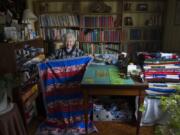 Nina Borroz, 98, has sewn about 150 to 200 quilts a year to donate to veterans organizations. Many have patriotic themes like this one she displays in the sewing room in her Minnehaha home on a recent morning.