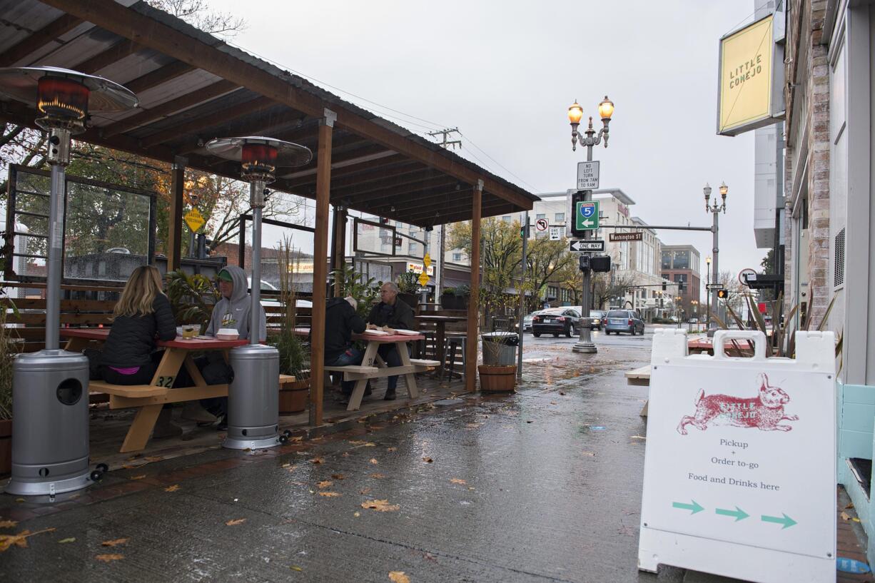 A roof protects customers in Little Conejo’s outdoor dining space in downtown Vancouver on Wednesday afternoon.