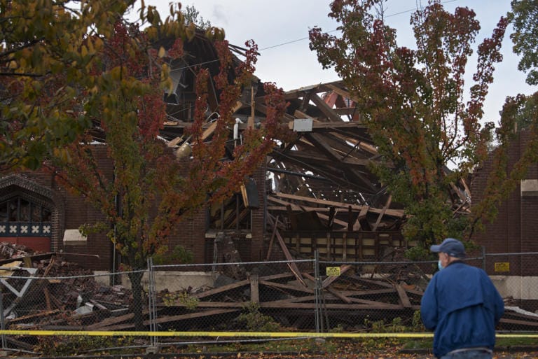 Gary Dunne of Vancouver pauses to take photos during the demolition of the former downtown location of New Heights Church on Friday morning, Nov. 13, 2020. Dunne was also joined by his wife, Marlene, who he married at the church in 1959. The couple raised three daughters there. "It just felt like home," Marlene Dunne said.