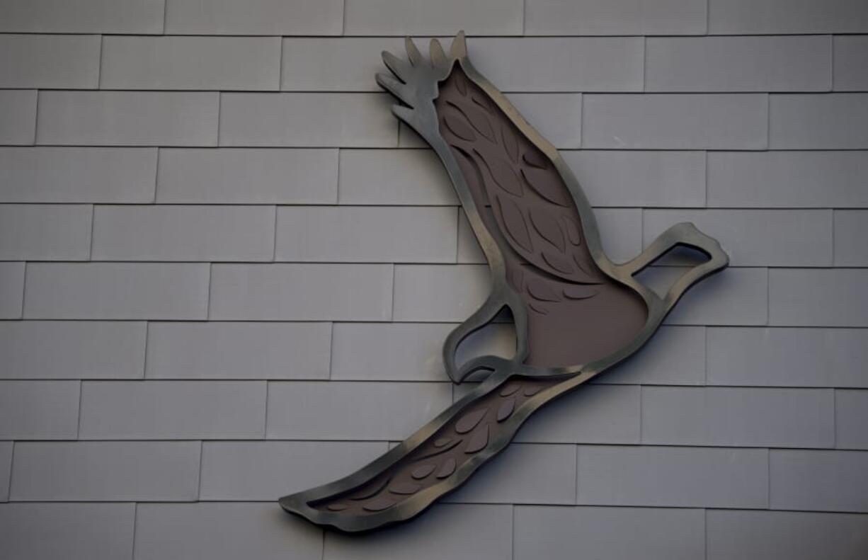 One of five metal eagles takes flight on the side of The Jean building at The Waterfront Vancouver on Monday. Artist Grace Chadwick designed the metal sculptures, five double-layered eagles, in her studio near Fish Hawk Lake, Ore.