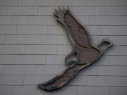 One of five metal eagles takes flight on the side of The Jean building at The Waterfront Vancouver on Monday. Artist Grace Chadwick designed the metal sculptures, five double-layered eagles, in her studio near Fish Hawk Lake, Ore.