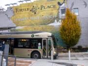 One of C-Tran&#039;s 60-foot Vine buses makes a stop at the Turtle Place stop on Tuesday in downtown Vancouver.