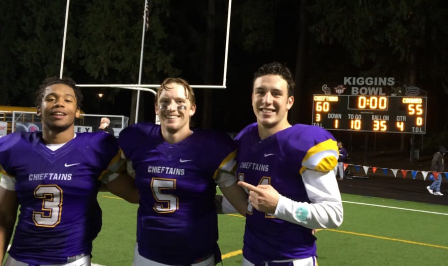 Columbia River&#039;s Travon Santiago (3), Garrett McKee (5) and Alex McGarry helped the Chieftains light up the scoreboard Friday, Nov. 5, 2015, in Columbia River&#039;s playoff win over Capital.