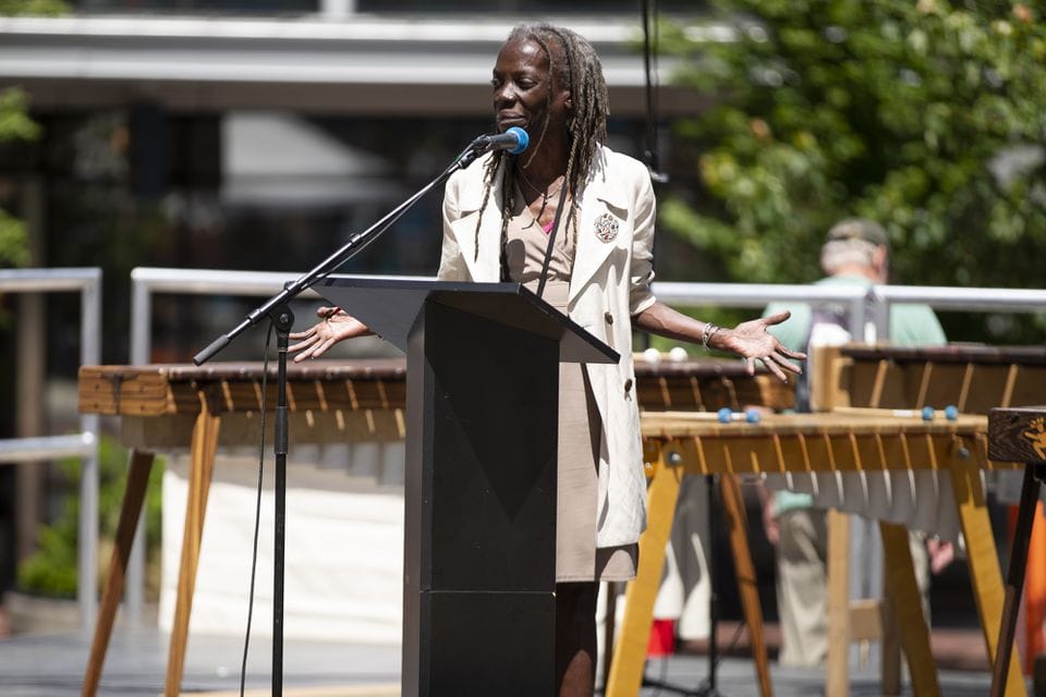 City of Portland Commissioner Jo Ann Hardesty spoke as several hundred people gathered in Director Park in Portland on Tuesday, June 4, 2019, in support of a group of young people who have filed a federal lawsuit asserting a constitutional right to a climate system capable of sustaining human life. Supporters watched videos, held signs and viewed a live stream of a hearing in the case before the 9th U.S. Circuit Court of Appeals in Portland.