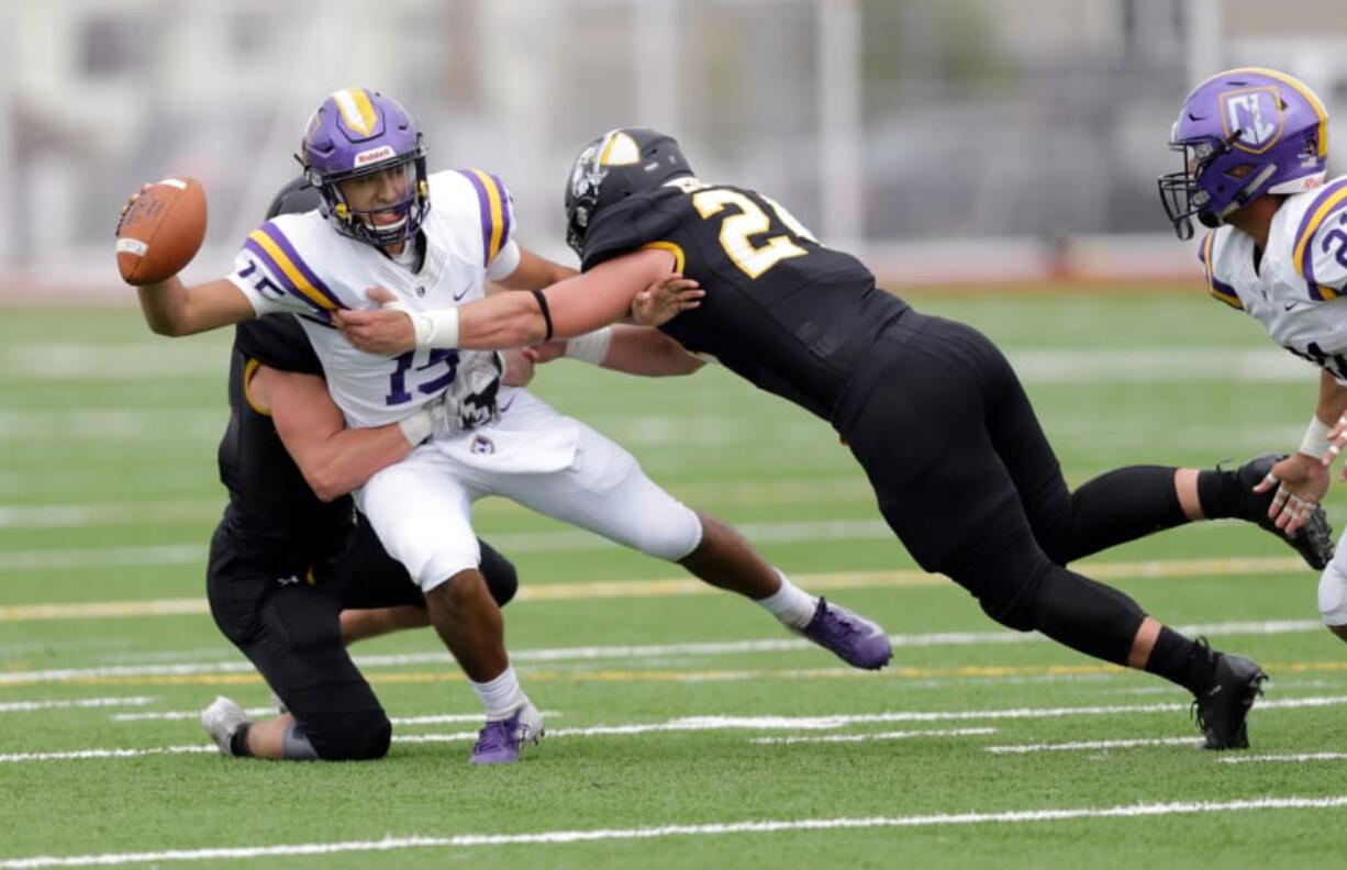 After a move to the defensive line as a junior, Woodland High grad Tristan Thomas (24) has flourished at Pacific Luthern. He appeared in all nine games last season, tallied 52 tackles, 5.5 sacks and was named an all-Northwest Conference honorable mention.