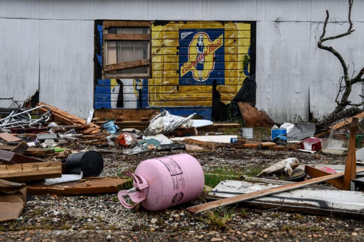 Debris caused by Hurricane Laura less than 6 weeks ago is seen on the street a day before upcoming Hurricane Delta in Lake Charles, Louisiana on October 8, 2020. - Hurricane Delta gained strength October 8, 2020, as it churned across the western Gulf of Mexico towards the United States, threatening to batter part of the Louisiana coast still recovering from a separate storm just weeks ago.