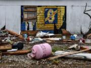 Debris caused by Hurricane Laura less than 6 weeks ago is seen on the street a day before upcoming Hurricane Delta in Lake Charles, Louisiana on October 8, 2020. - Hurricane Delta gained strength October 8, 2020, as it churned across the western Gulf of Mexico towards the United States, threatening to batter part of the Louisiana coast still recovering from a separate storm just weeks ago.