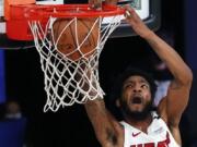 Miami Heat&#039;s Derrick Jones Jr. dunks against the Oklahoma City Thunder during the second half of an NBA basketball game Wednesday, Aug. 12, 2020, in Lake Buena Vista, Fla. (Kevin C.