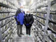 Lonnie Thompson, left, and Ellen Mosley-Thompson, paleoclimatologists in their ice core freezer at the Byrd Polar Climate and Research Center at Ohio State University.