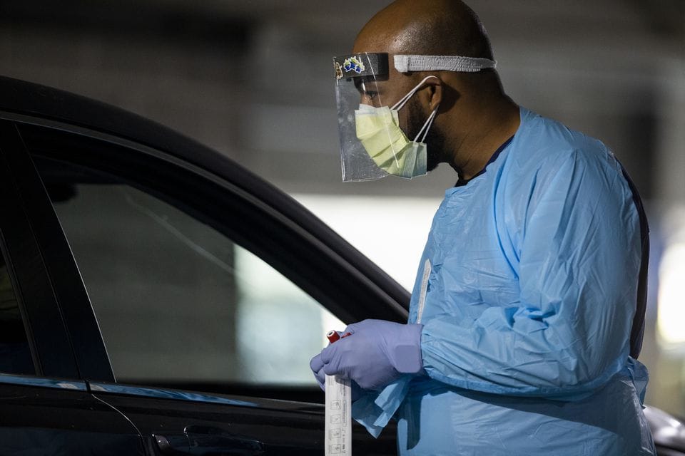 People waited in long lines for drive-through COVID-19 tests administered by OHSU at the Oregon Convention Center on Thurs., Nov. 12, 2020.