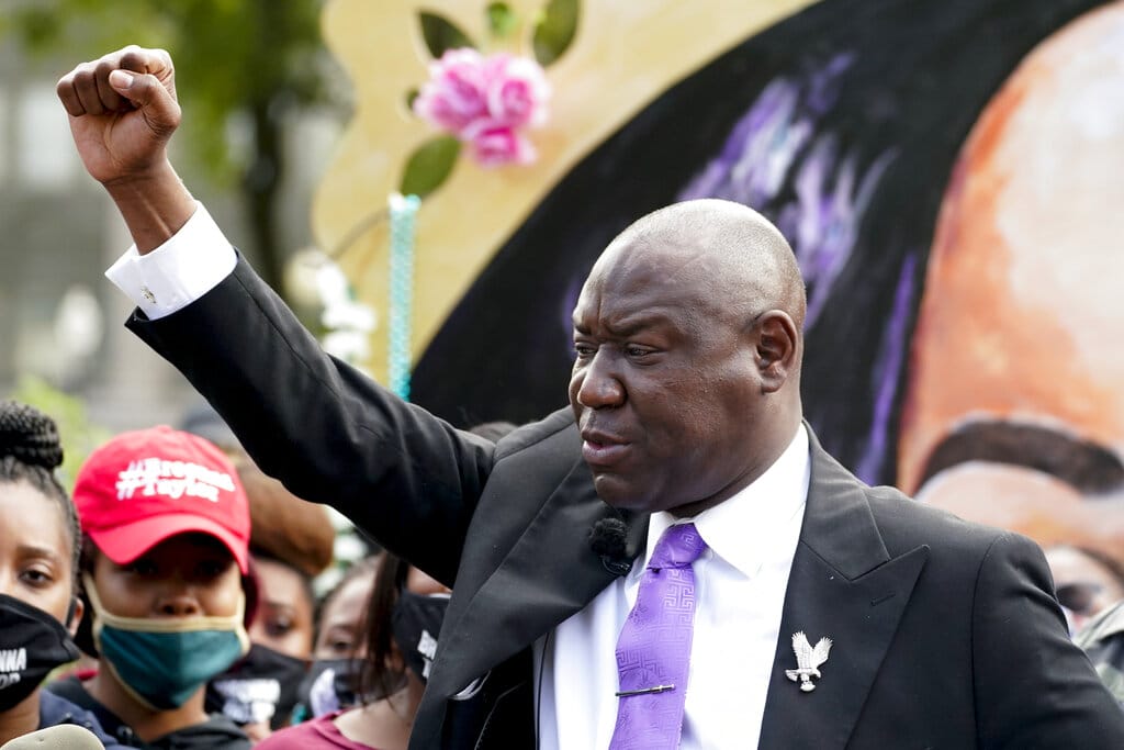 Kevin Peterson Jr. family attorney Ben Crump, center speaks during a news conference Sept. 25 in Louisville, Ky.  Crump also represents the family of Breona Taylor.