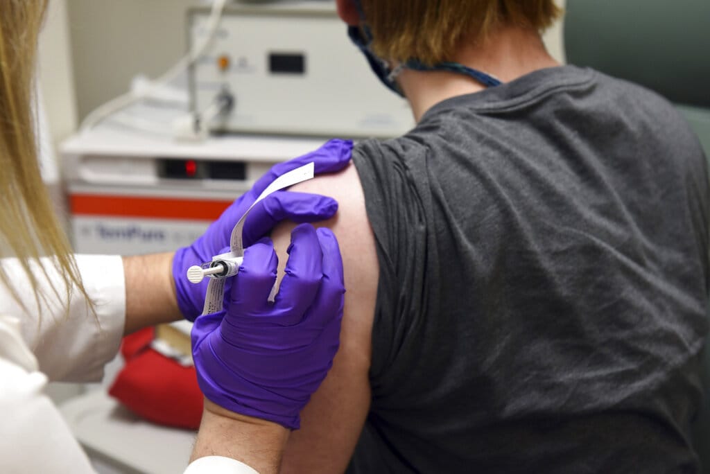 This May 4, 2020, file photo provided by the University of Maryland School of Medicine, shows the first patient enrolled in Pfizer's COVID-19 coronavirus vaccine clinical trial at the University of Maryland School of Medicine in Baltimore.  On Monday, Pfizer said an early peek at its vaccine data suggests the shots may be 90% effective at preventing COVID-19.