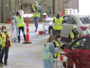 This 2020 photo provided by Carlton County shows their drive-thru flu clinic in Carlton, Minn. The facility is a way to social distance in the coronavirus pandemic, but also served as a test run for the COVID-19 vaccines that county health officials still know little about.