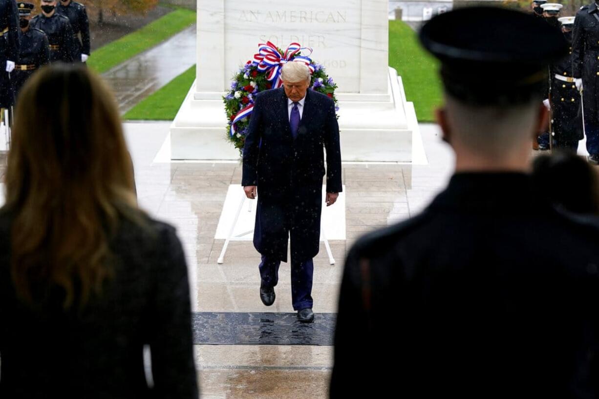 President Donald Trump participates in a Veterans Day wreath laying ceremony at the Tomb of the Unknown Soldier at Arlington National Cemetery in Arlington, Va., Wednesday, Nov. 11, 2020.