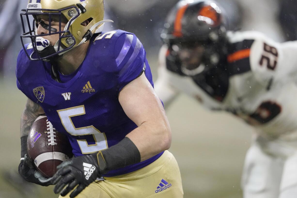 Washington running back Sean McGrew (5) runs for a touchdown against Oregon State during the first half of an NCAA college football game, Saturday, Nov. 14, 2020, in Seattle. (AP Photo/Ted S.