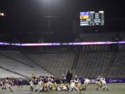 Washington running back Sean McGrew (5) rushes against Oregon State in a Husky Stadium void of fans during the coronavirus pandemic, during the first half of an NCAA college football game Saturday, Nov. 14, 2020, in Seattle. (AP Photo/Ted S.