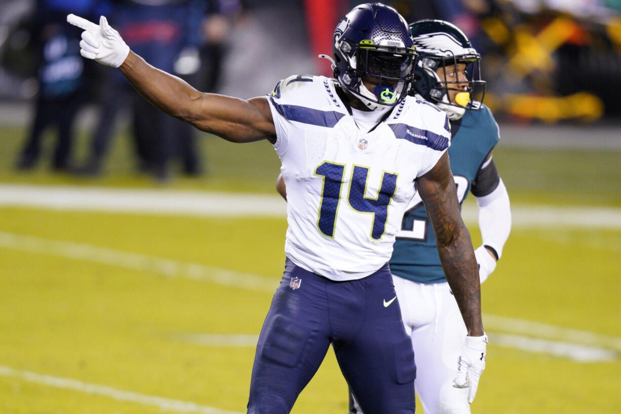 Seattle Seahawks' DK Metcalf reacts after a first down catch during the first half of an NFL football game against the Philadelphia Eagles, Monday, Nov. 30, 2020, in Philadelphia.