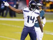 Seattle Seahawks' DK Metcalf reacts after a first down catch during the first half of an NFL football game against the Philadelphia Eagles, Monday, Nov. 30, 2020, in Philadelphia.