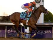 John Velazquez (9) rides Authentic to win the Breeder&#039;s Cup Classic horse race at Keeneland Race Course, in Lexington, Ky., Saturday, Nov. 7, 2020.