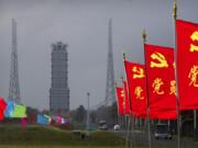 Flags with the logo of the Communist Party of China fly in the breeze near a launch pad at the Wenchang Space Launch Site in Wenchang in southern China&#039;s Hainan province, Monday, Nov. 23, 2020. Chinese technicians were making final preparations Monday for a mission to bring back material from the moon&#039;s surface for the first time in nearly half a century -- an undertaking that could boost human understanding of the moon and of the solar system more generally.