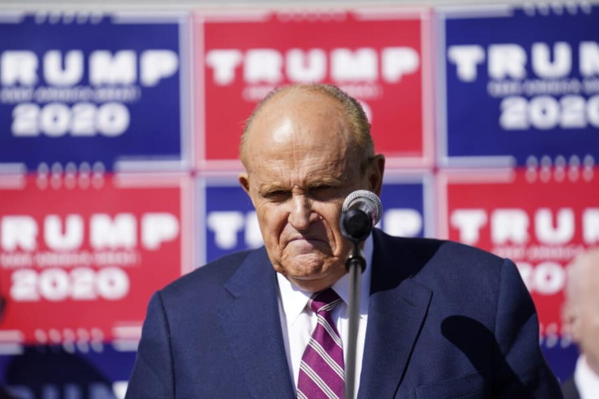 Former New York mayor Rudy Giuliani, a lawyer for President Donald Trump, pauses as he speaks during a news conference on legal challenges to vote counting in Pennsylvania, Saturday Nov. 7, 2020, in Philadelphia.