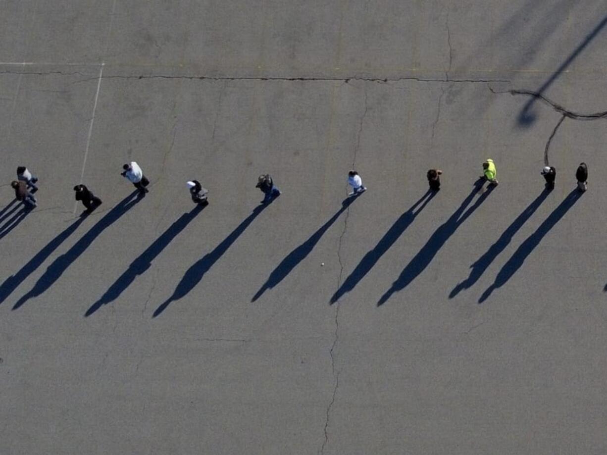 People line up to vote at the Milwaukee County Sports Complex Tuesday, Nov. 3, 2020, in Franklin, Wis.