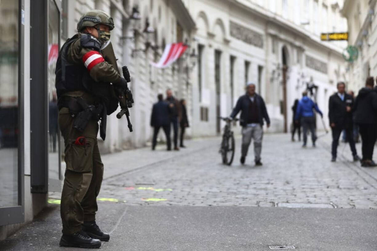 A military police officer guard at the crime scene near a synagogue in Vienna, Austria, Wednesday, Nov. 4, 2020. Several shots were fired shortly after 8 p.m. local time on Monday, Nov. 2, in a lively street in the city center of Vienna.