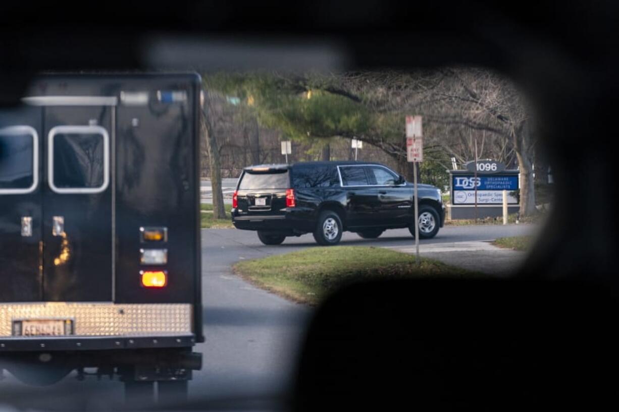 A motorcade with President-elect Joe Biden aboard arrives at Delaware Orthopaedic Specialists to see a doctor, Sunday, Nov. 29, 2020, in Newark, Del. Biden slipped while playing with his dog Major, and twisted his ankle.