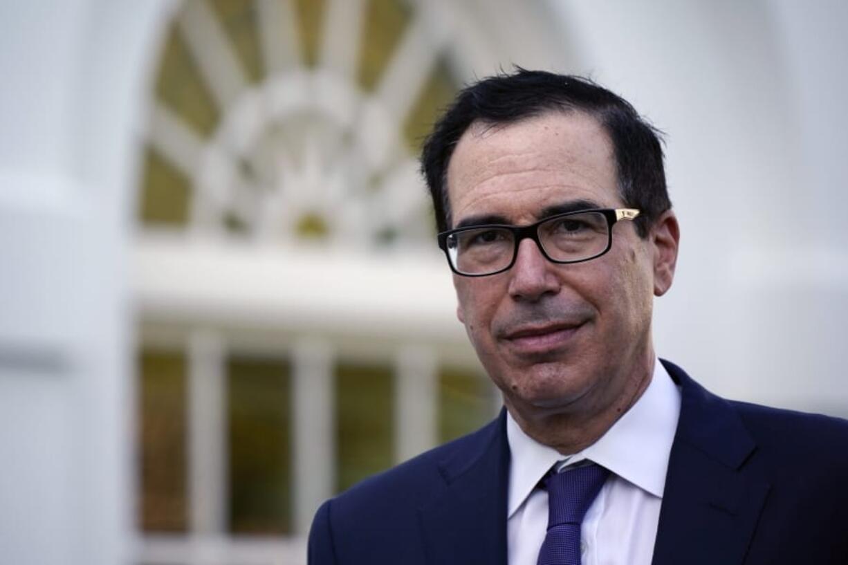 FILE - This Aug. 24, 2020 file photo shows Treasury Secretary Stephen Mnuchin at the White House in Washington.  The U.S. is starting the 2021 budget year the way the old year ended, with soaring deficits. The Treasury Department reported Thursday, Nov. 12  that the federal government ran up a record October deficit of $284.1 billion, nearly double the red ink of a year ago. (AP Photo/J.