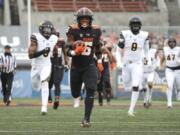 Oregon State running back Jermar Jefferson (6) runs 75-yards to score a touchdown on the first play of an NCAA college football game against California in Corvallis, Ore., Saturday, Nov. 21, 2020.